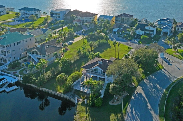 bird's eye view with a water view and a residential view