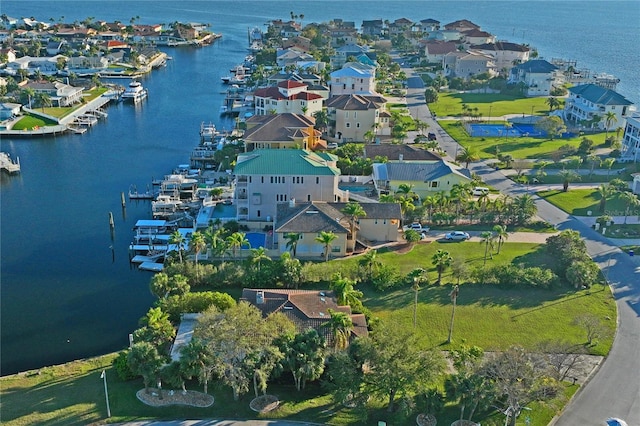 drone / aerial view featuring a water view and a residential view