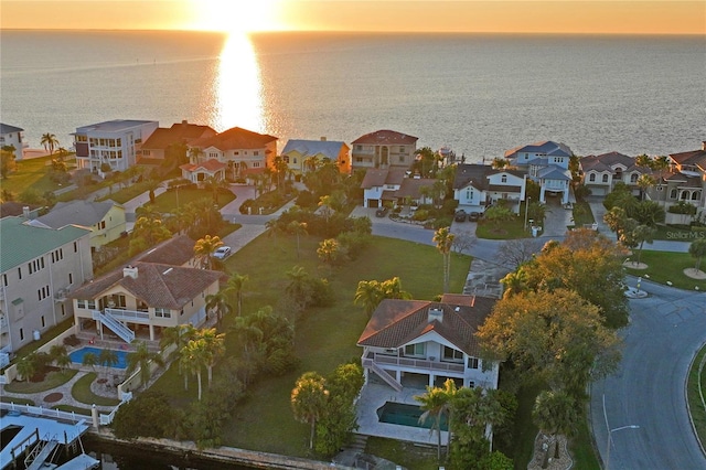 aerial view with a water view and a residential view