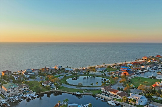 birds eye view of property with a residential view and a water view