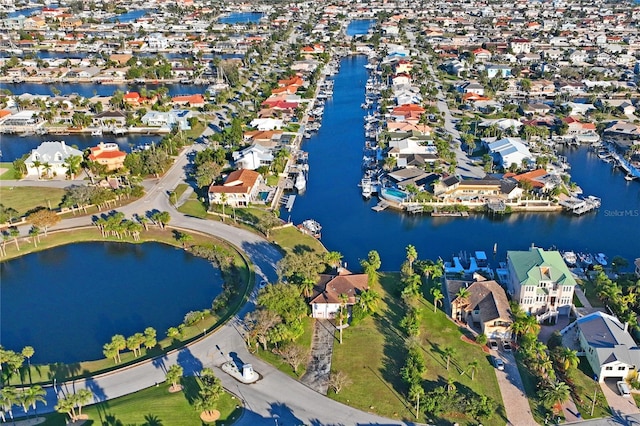 birds eye view of property featuring a residential view and a water view