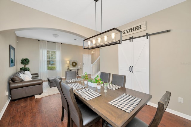 dining room with arched walkways, dark wood-style flooring, stairway, and baseboards