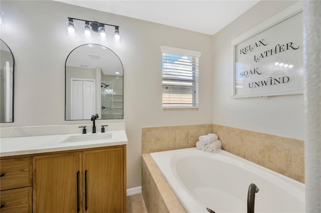 full bathroom with a shower, vanity, and a bath