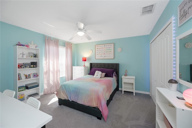 bedroom with carpet flooring, a ceiling fan, visible vents, baseboards, and a closet