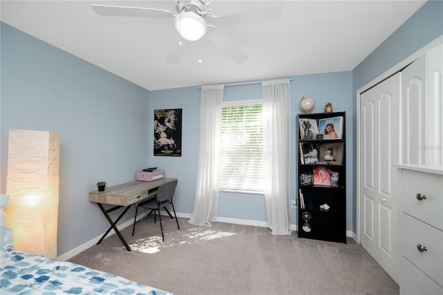 bedroom featuring carpet floors, ceiling fan, baseboards, and a closet