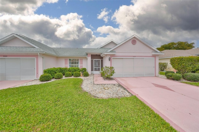 single story home featuring a garage, driveway, a front yard, and stucco siding