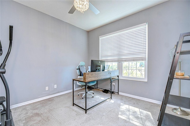 office area with carpet floors, baseboards, and a ceiling fan