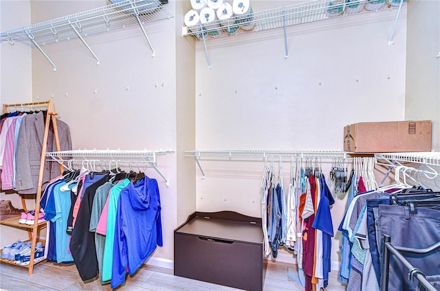 spacious closet with wood finished floors