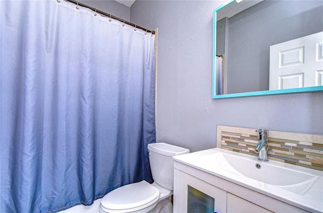 full bath with vanity, backsplash, and toilet