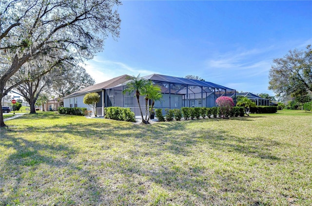 view of property exterior with a lanai and a yard