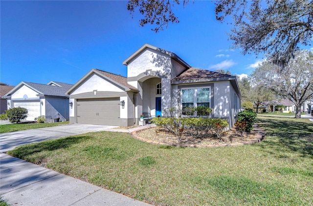 view of front of house with concrete driveway, stucco siding, an attached garage, and a front yard