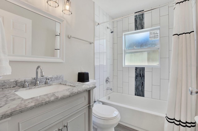 full bathroom with shower / bath combo, vanity, and toilet