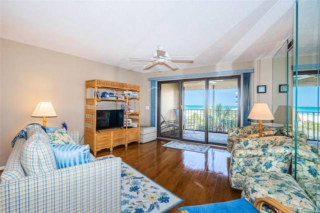 living area featuring ceiling fan and wood finished floors