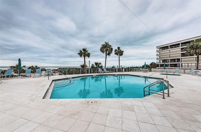 pool with a patio area