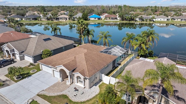 drone / aerial view with a residential view and a water view