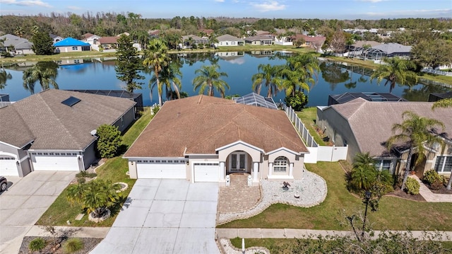 birds eye view of property with a residential view and a water view