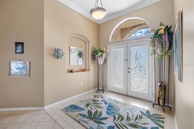 foyer with french doors, ornamental molding, tile patterned flooring, and baseboards