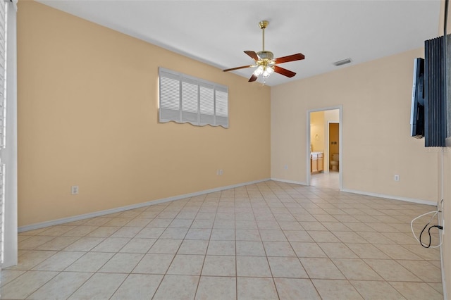 empty room featuring visible vents, ceiling fan, baseboards, and light tile patterned flooring