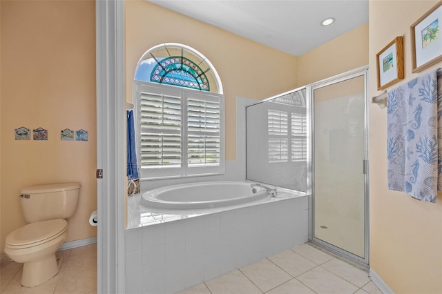 full bath featuring a stall shower, a garden tub, and tile patterned floors