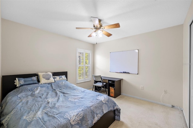 bedroom featuring carpet floors, a ceiling fan, and baseboards