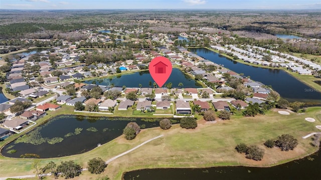 drone / aerial view featuring a water view and a residential view