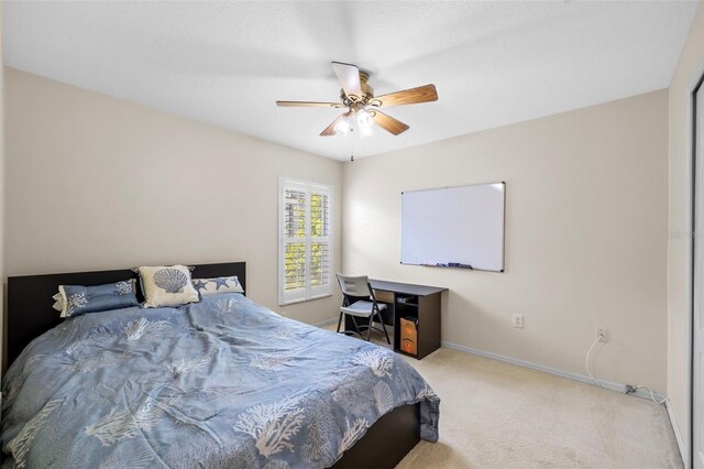 5117 Spectacular Bid Dr, Wesley Chapel, FL 33544 - bedroom with carpet flooring, baseboards, and ceiling fan