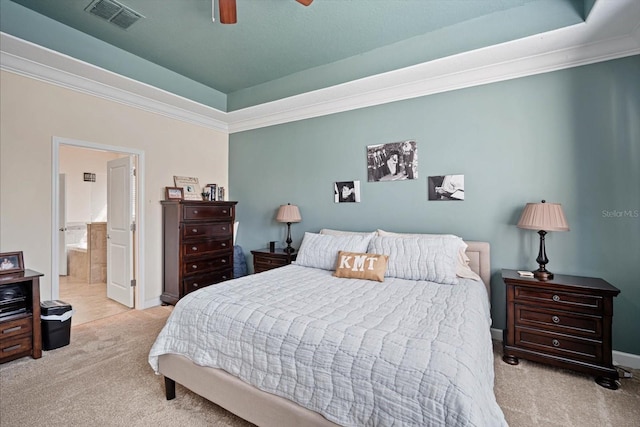 bedroom with light carpet, a raised ceiling, and visible vents