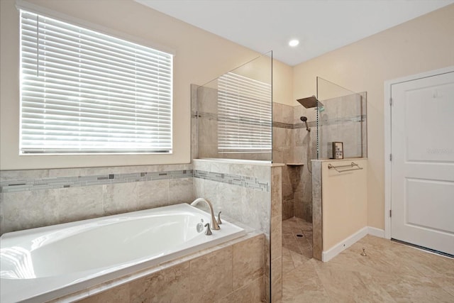 full bath featuring a garden tub, baseboards, and walk in shower