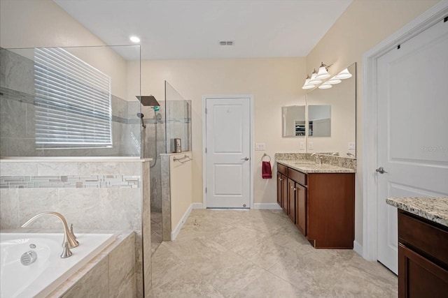 full bath with a garden tub, visible vents, walk in shower, and vanity