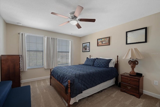 bedroom featuring carpet floors, ceiling fan, and baseboards