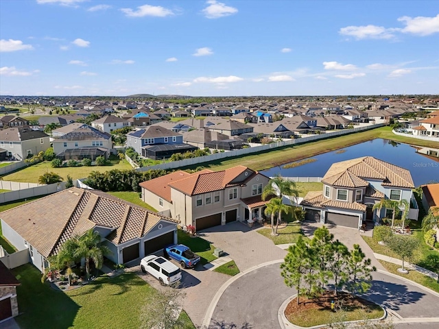 bird's eye view featuring a residential view and a water view