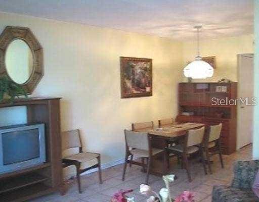 dining space with tile patterned floors and baseboards