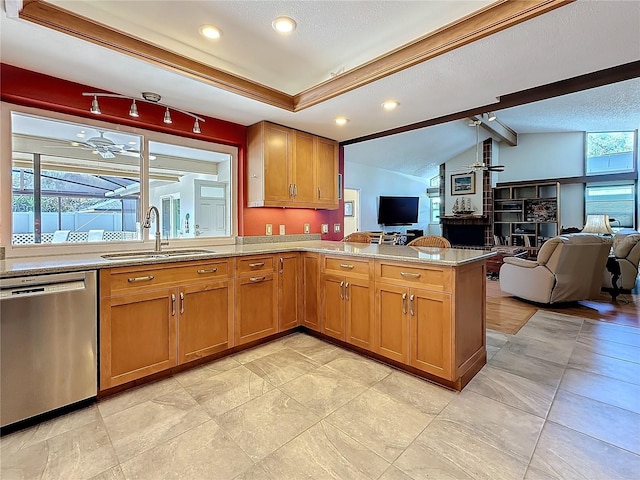 kitchen featuring a ceiling fan, open floor plan, a peninsula, stainless steel dishwasher, and a sink