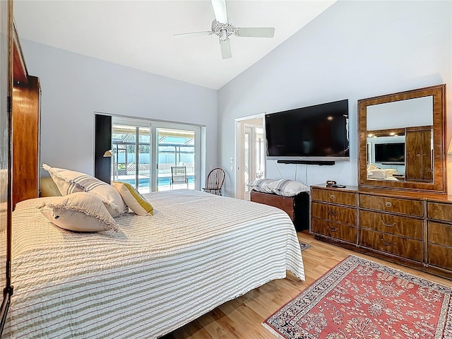 bedroom featuring access to exterior, light wood-style floors, high vaulted ceiling, and ceiling fan