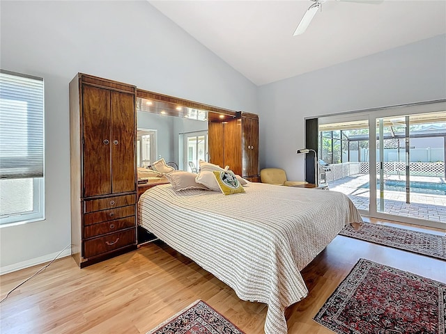 bedroom with light wood finished floors, ceiling fan, high vaulted ceiling, access to outside, and baseboards