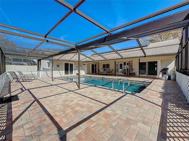 pool featuring a lanai and a patio