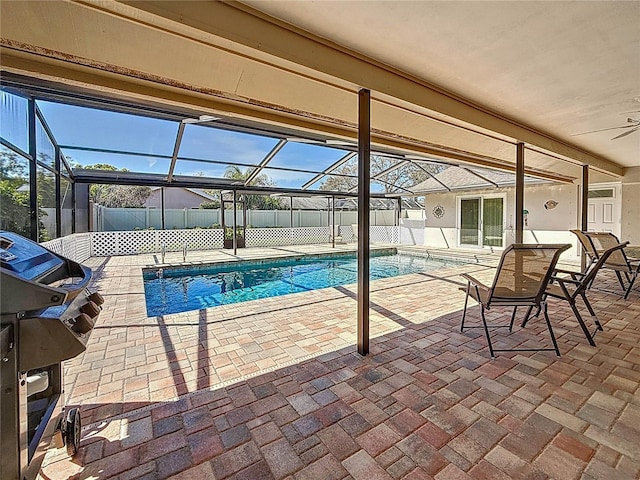 view of pool featuring a patio, fence private yard, a lanai, area for grilling, and a fenced in pool