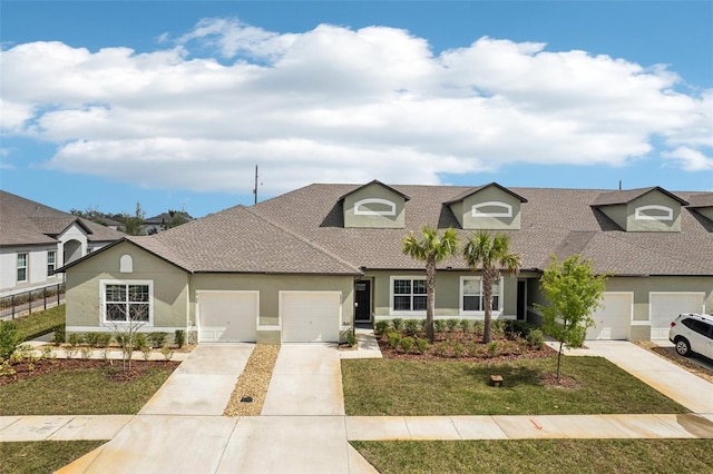 view of front of home with a garage, driveway, roof with shingles, stucco siding, and a front yard