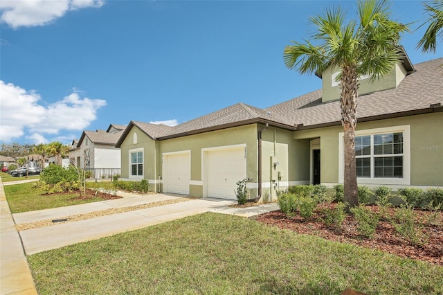 view of front of house featuring roof with shingles, stucco siding, a garage, driveway, and a front lawn