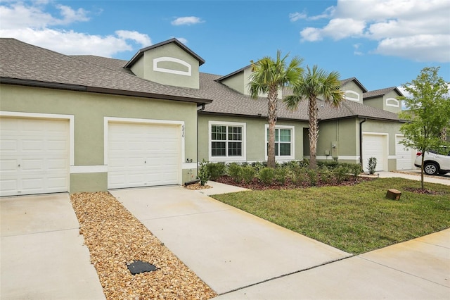 multi unit property featuring a garage, a shingled roof, concrete driveway, and stucco siding