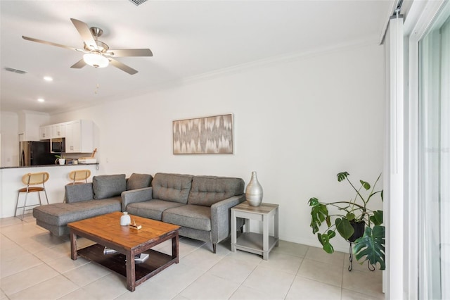 living room featuring crown molding, recessed lighting, visible vents, light tile patterned flooring, and ceiling fan