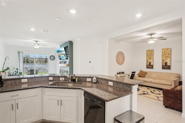 kitchen with visible vents, open floor plan, a sink, dark stone counters, and dishwasher