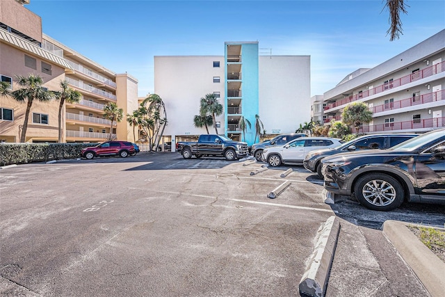 view of property featuring uncovered parking