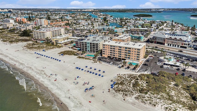 birds eye view of property with a view of city, a beach view, and a water view