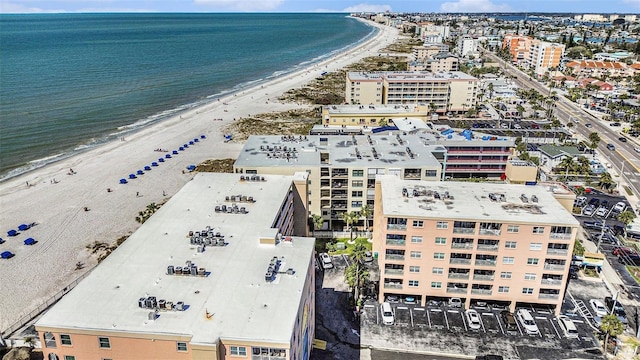 birds eye view of property with a view of the beach and a water view