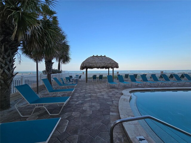 12924 Gulf Blvd Unit 110, Saint Petersburg, FL 33708 - view of swimming pool featuring a patio area and a water view