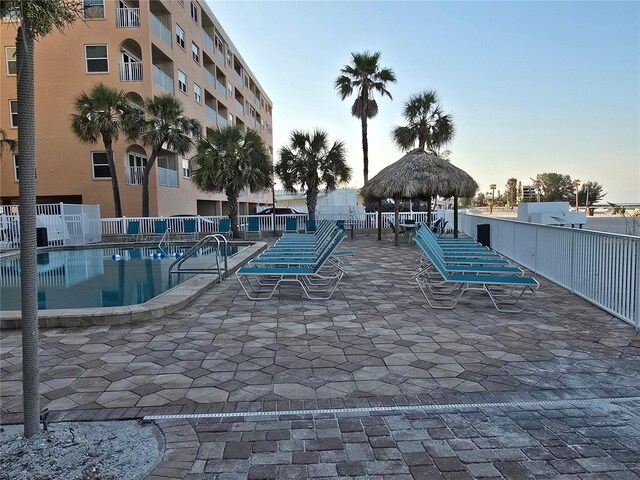 12924 Gulf Blvd Unit 110, Saint Petersburg, FL 33708 - view of community featuring a gazebo and a pool