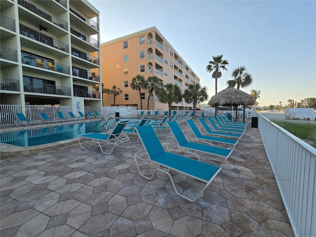 12924 Gulf Blvd Unit 110, Saint Petersburg, FL 33708 - pool at dusk featuring a gazebo