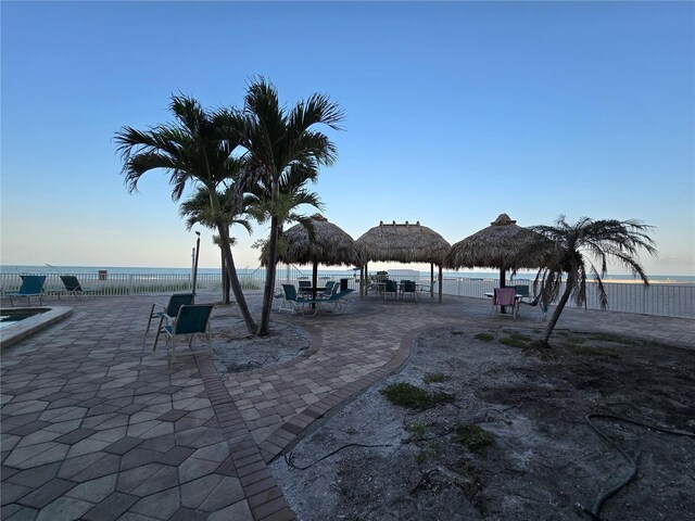 12924 Gulf Blvd Unit 110, Saint Petersburg, FL 33708 - view of home's community with a patio area and a water view
