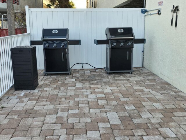 12924 Gulf Blvd Unit 110, Saint Petersburg, FL 33708 - view of patio / terrace featuring grilling area